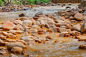 Poluted creek with kaolin photo