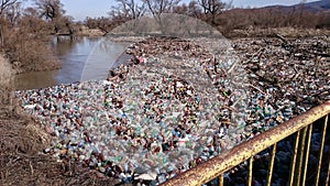 Polution with plastic waste on a river