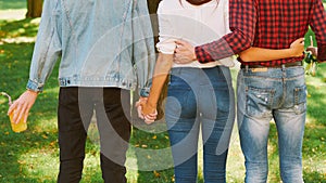 Polyamorous relationship woman standing two guys photo