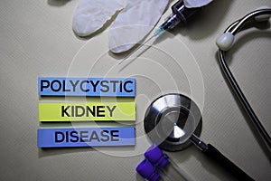 Polycystic Kidney Disease text on Sticky Notes. Top view isolated on office desk. Healthcare/Medical concept