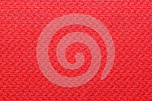 Polyester cationic texture material red synthetic fabric macro elastic band background closeup