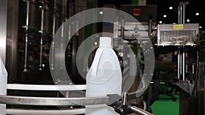 polyethylene gallon in conveyor labelling machine