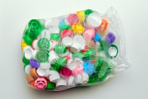 Polyethylene garbage bag with plastic lids of different colors