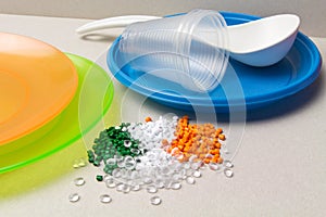 Polyethylene granules and disposable tableware made of polyethylene, polypropylene. Plastic Raw material and its products. photo