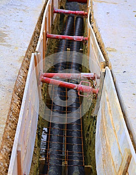 Polyethylene pipes in the excavation of the road construction site