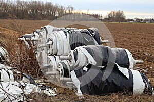 Polyethylene rolls on the outskirts of the asparagus field