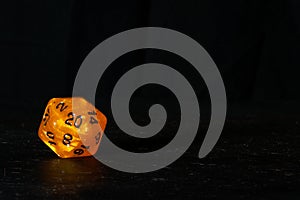 A polyhedral twenty sided die used for role playing games such a photo