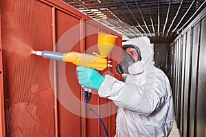 Polymer coating of metal detail with powder spraying gun