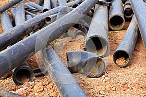 Polymer pipes cluttered on dry soil