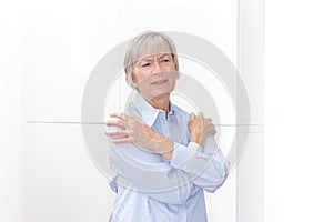 Polymyalgia senior woman painful upper arms