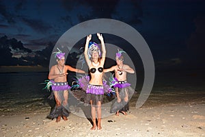 Polynesian Cook Islander dancers dancing on Muril beach lagoon i