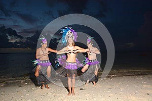 Polynesian Cook Islander dancers dancing on Muril beach lagoon i