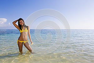 Polynesian girl in a yellow bikini