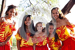 Polynesian Hula girls smiling at camera