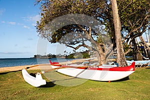 Polynesian outrigger canoe on the beach