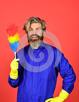 Polypropylene duster. Hipster holding cleaning tool. Cleaning home concept. Small colorful duster broom. Cleaning