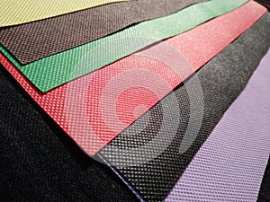 Polypropylene Spunbond Nonwoven Fabric with different colours on white background