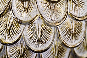 Polystone resin statue of owl feathers. Close up macro shot .