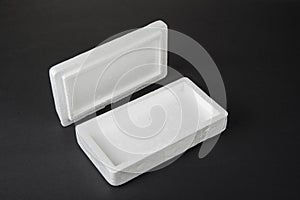 Polystyrene box on a black background for smartphone