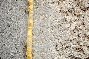 Polyurethane foam filled crack in the wall