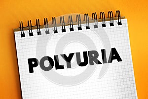 Polyuria is excessive or an abnormally large production or passage of urine, text on notepad photo