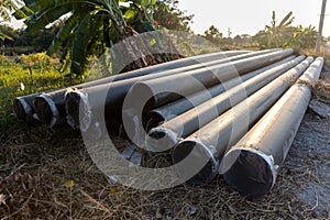 Polyvinyl chloride Drainage Pipe on a Construction Site. Polyvinyl chloride drainage pipes stacked for construction. Polyvinyl chl photo