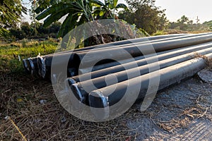 Polyvinyl chloride Drainage Pipe on a Construction Site. Polyvinyl chloride drainage pipes stacked for construction. Polyvinyl chl photo