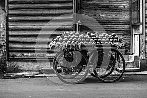 A pomegranate cart is waiting for customer at street of chandni chowk