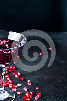 Pomegranate cocktail and ripe red pomegranate fruit