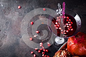 Pomegranate cocktail and ripe red pomegranate fruit