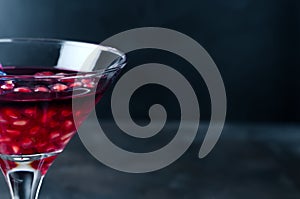 Pomegranate cocktail and ripe red pomegranate fruit