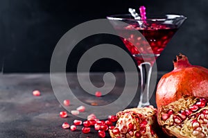 Pomegranate cocktail and ripe red pomegranate fruit