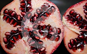 Pomegranate cut open with a unique pattern of seeds