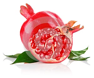 Pomegranate fresh fruits with cut and green leaves