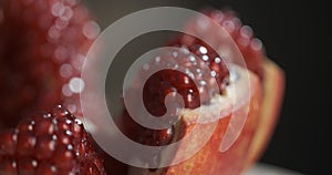 Pomegranate fruit. Fresh and ripe Pomegranates rotating over black Background. Organic Bio fruits close-up. Diet