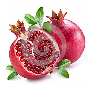 Pomegranate fruit with green leaves on a white background.