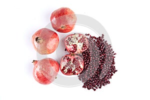 Pomegranate fruits and seeds on whit ebackground