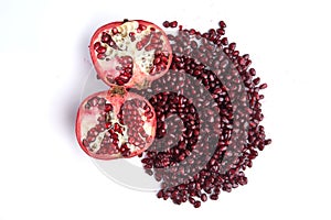 Pomegranate fruits and seeds on whit ebackground