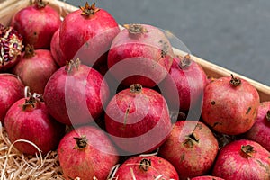 Pomegranate fruits. A vegetable counter at a street market.