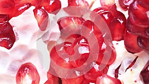 pomegranate grains close-up. Slow rotation of a broken pomegranate close-up