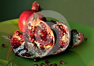 Pomegranate on green dish