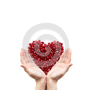 Pomegranate heart in hands