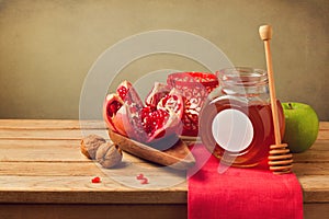 Pomegranate and honey for Rosh Hashanah holiday. Jewish New Year.