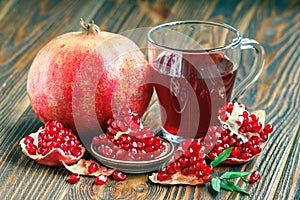 Pomegranate juice with ripe fresh punica granatum fruits