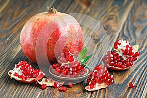 Pomegranate juice with ripe fresh punica granatum fruits photo