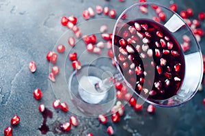 Pomegranate martini with pomegranate seeds in a glass