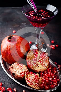 Pomegranate martini with pomegranate seeds in a glass