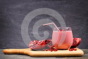 Pomegranate raspberry smoothie on a paddle board over black slate