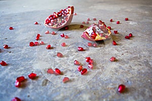 Pomegranate with scattered seeds