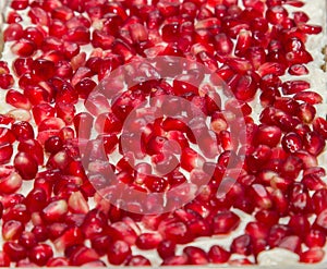 Pomegranate seeds background in salad